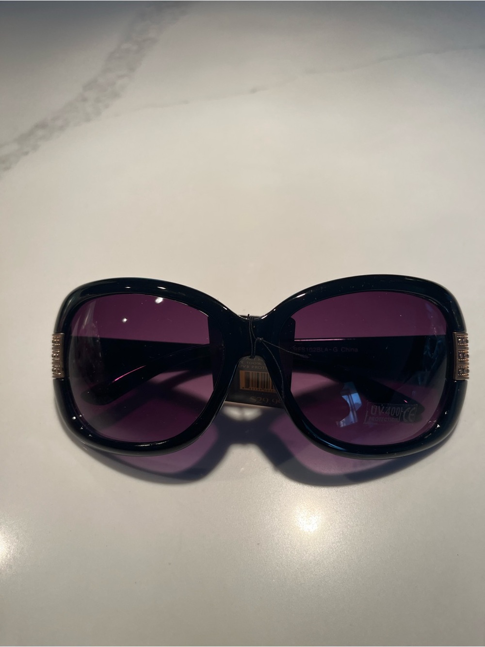 NWT fabulous oversized black sunglasses with gold tone design on front & sides.